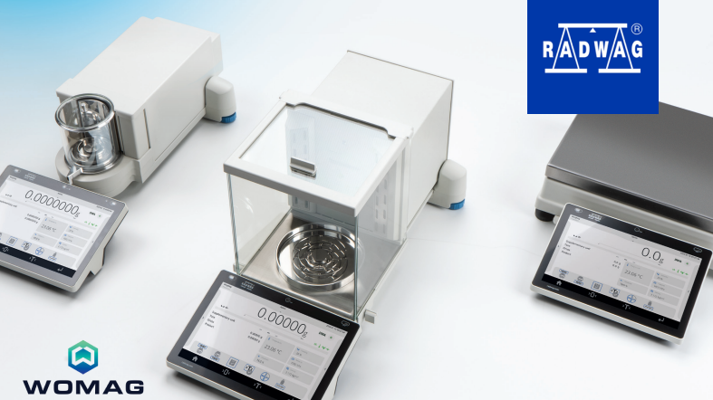 Silver analytical balance with a transparent glass enclosure and digital display