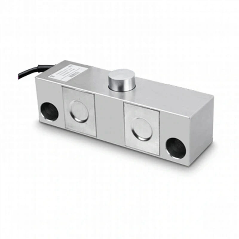 Silver metallic rectangular load cell with a cylindrical top knob and circular mounting holes on its sides