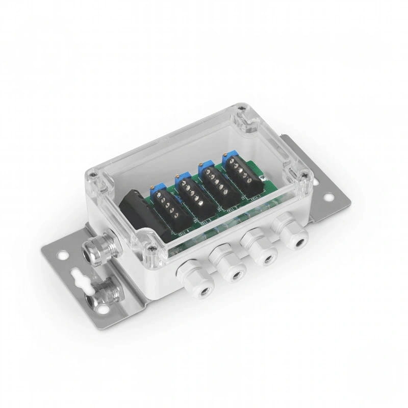 Clear plastic housing with metallic mounting plate and white threaded connectors, containing a green circuit board with black terminal blocks