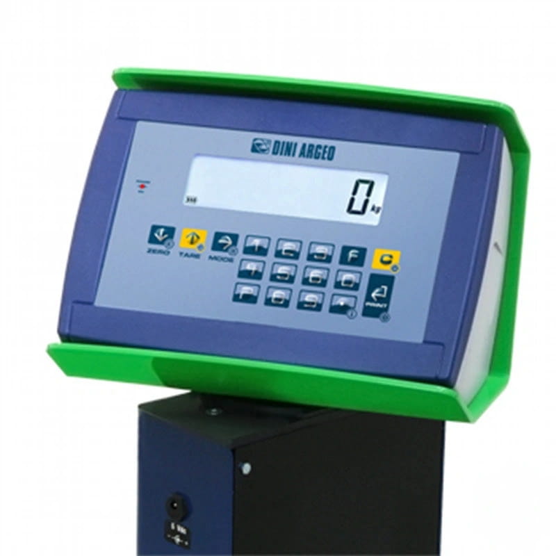 Blue and green digital scale with a display showing ’0 kg’ and labeled ’dini arceo.’
