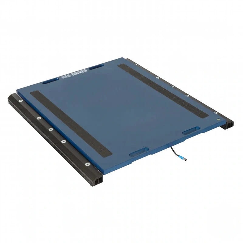 Blue industrial weighing platform with black rubber strips and a connected cable
