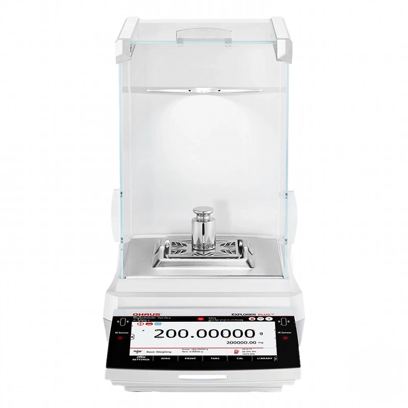 White ohaus explorer plus™ analytical balance with a clear glass draft shield and digital display showing 200.00000 g, featuring a stainless steel weighing pan and chrome-plated weight on top