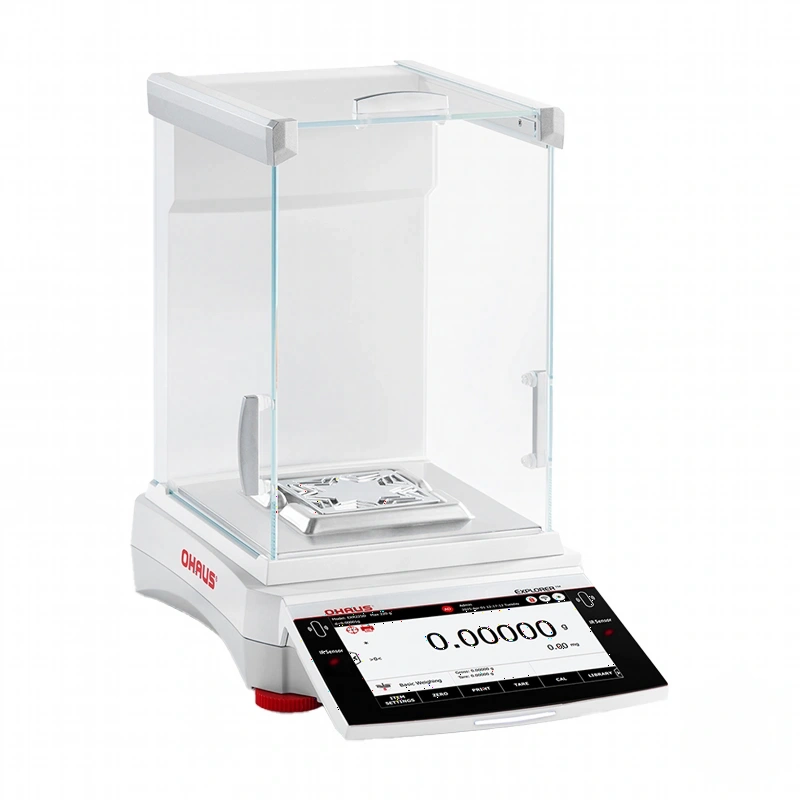 White ohaus analytical balance with a transparent glass draft shield and digital display showing zeroed weight