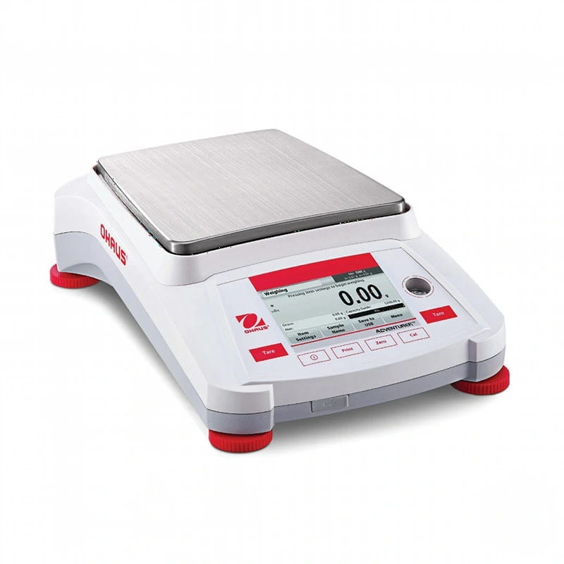 White ohaus adventurer analytical balance with a silver weighing platform and red-accented feet