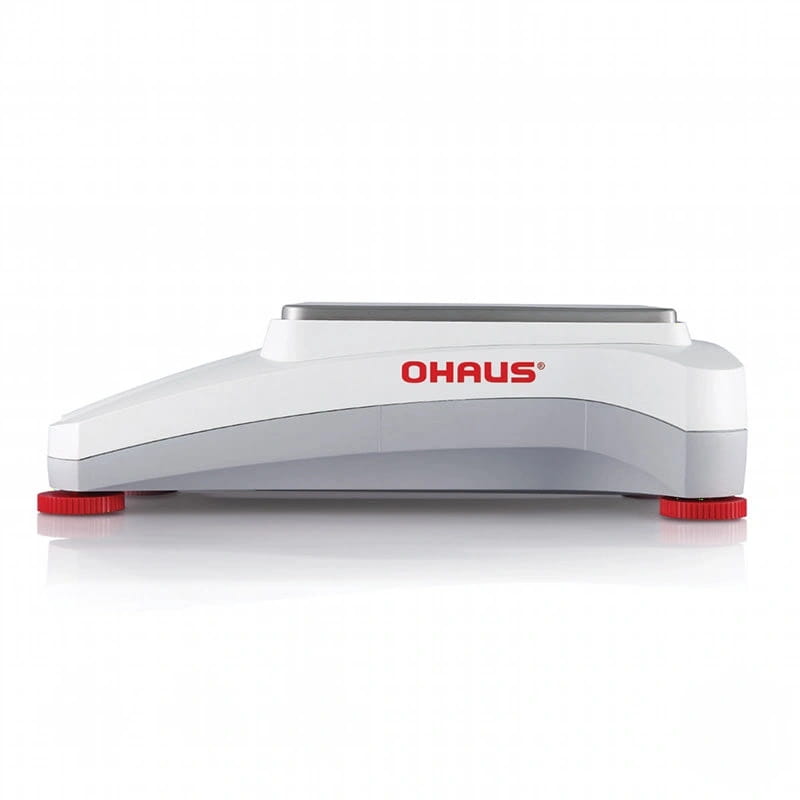 White and gray ohaus digital scale with red foot caps