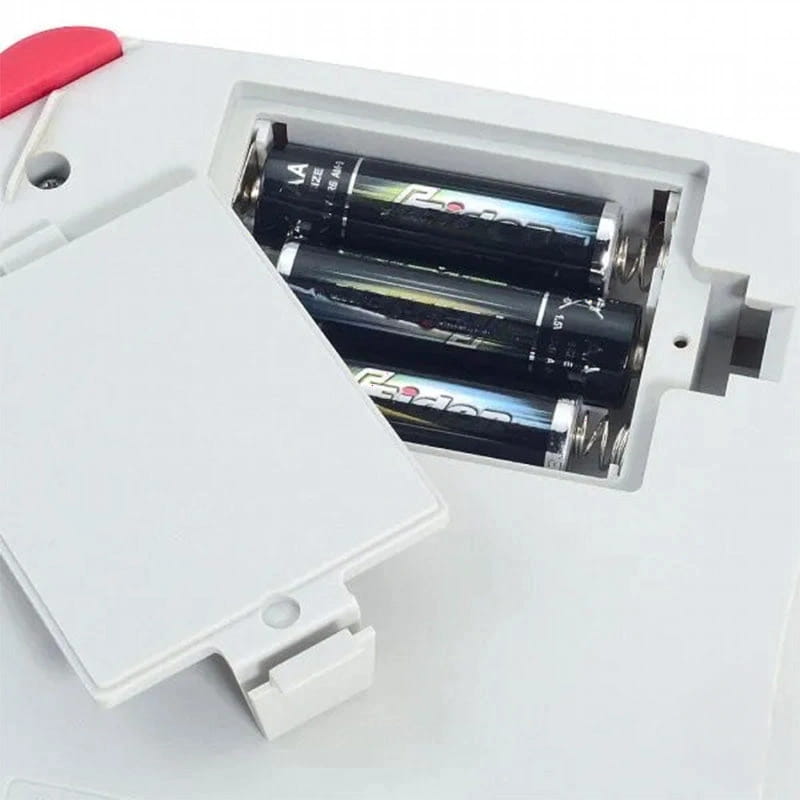 White plastic battery compartment with a red accent, housing two black aa batteries