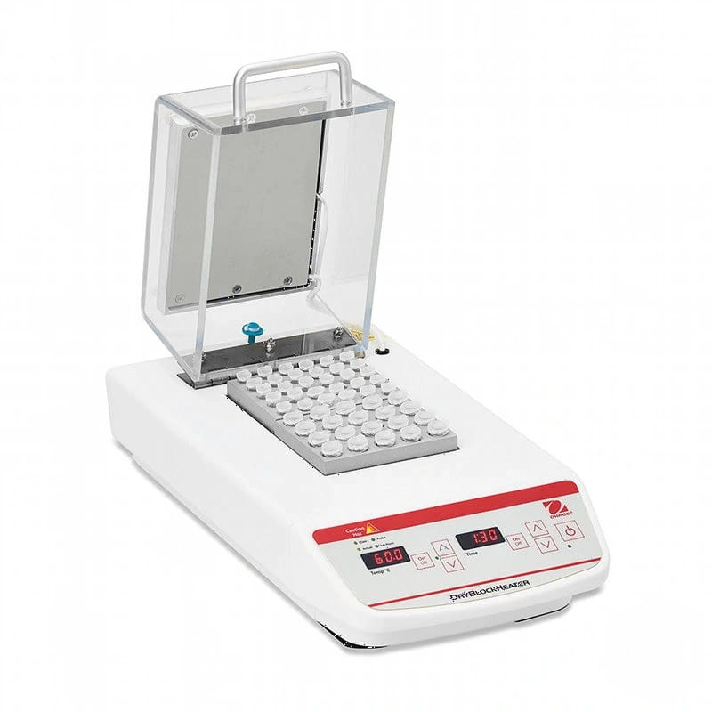 White laboratory-grade dry bath heater with a transparent lid, digital display showing temperature settings, and an array of circular wells for holding test tubes or small containers