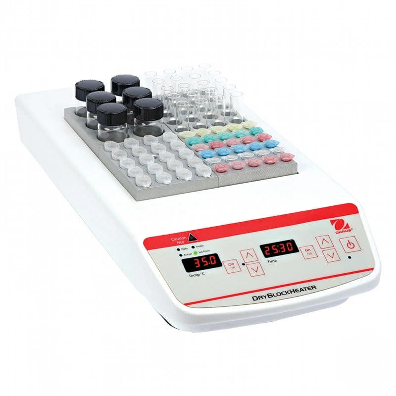 White ohaus dryblockheater with digital display showing 35.0°c and 25:30, featuring a silver heating plate holding test tubes and vials in organized rows of varying colors including black, clear, pink, blue