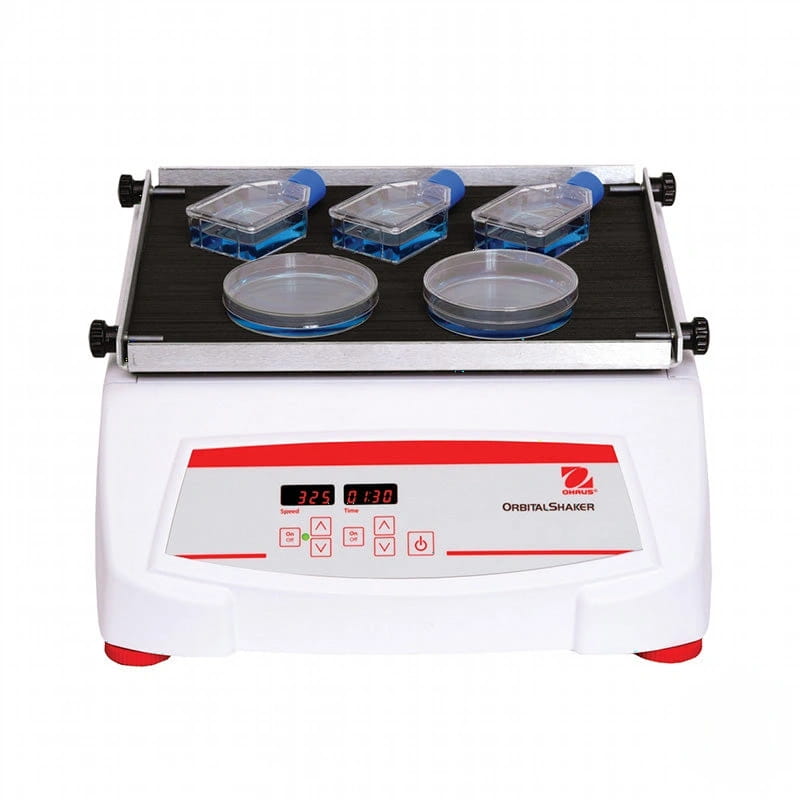 White and red orbital shaker with digital display showing speed and time, featuring three clear plastic containers and two glass petri dishes on its platform