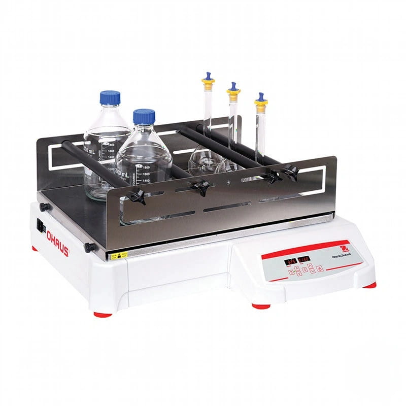 White ohaus gigashaker laboratory shaker with a stainless steel platform holding glass bottles and graduated cylinders