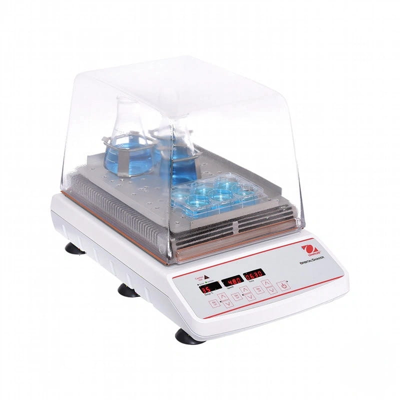 White laboratory incubator with transparent lid, featuring digital controls and a heating plate for holding glassware