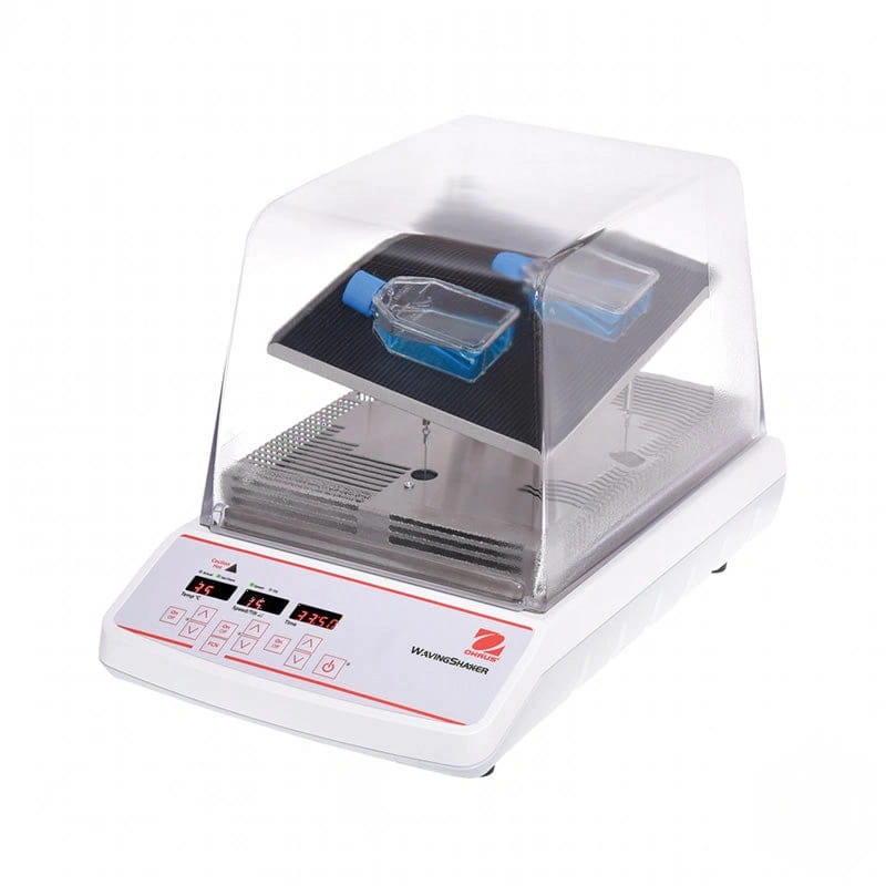 White lab-grade wave shaker with transparent acrylic lid and digital control panel