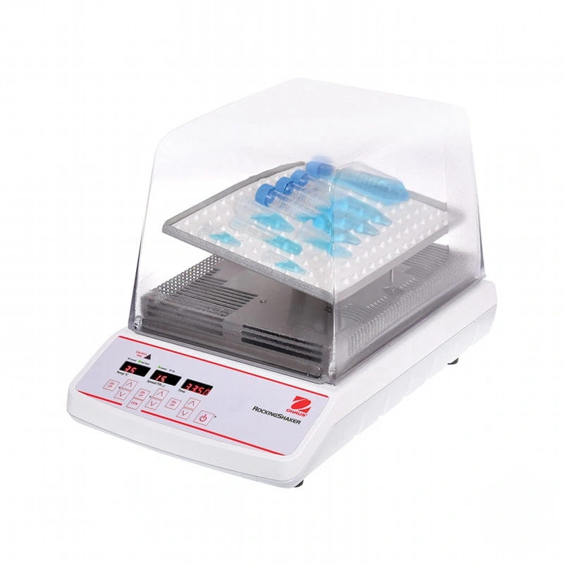 White digital rockershaker with transparent lid and blue-tipped test tubes arranged on a perforated tray
