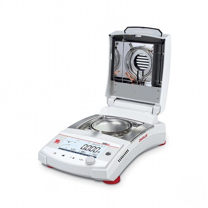 White ohrus m102 laboratory balance with a digital display and open lid revealing its internal heating chamber