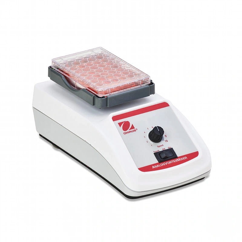 White and red ohaus analog vortex mixer with a clear plastic tray holding multiple round wells