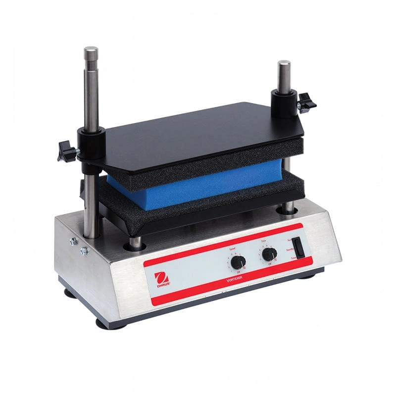 Silver laboratory mixing machine with black and blue components, red control panel featuring knobs and a power switch