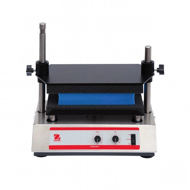 Silver and red branded laboratory device with black platform, blue cushioned pad, and adjustable metal rods