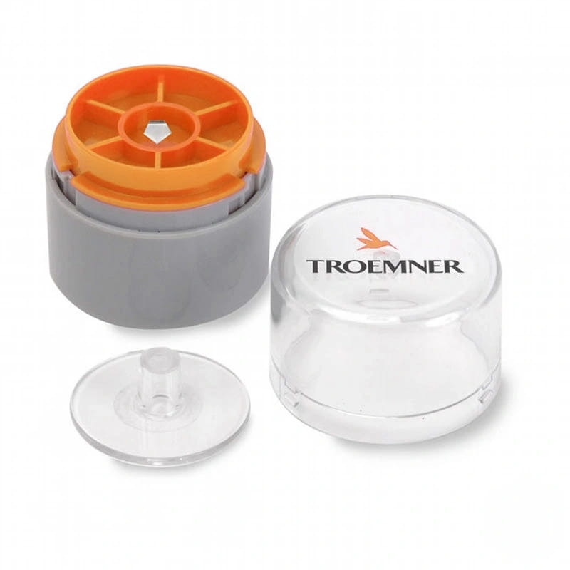 Clear plastic cylindrical container with orange and gray components, branded ’troemner’ on the lid