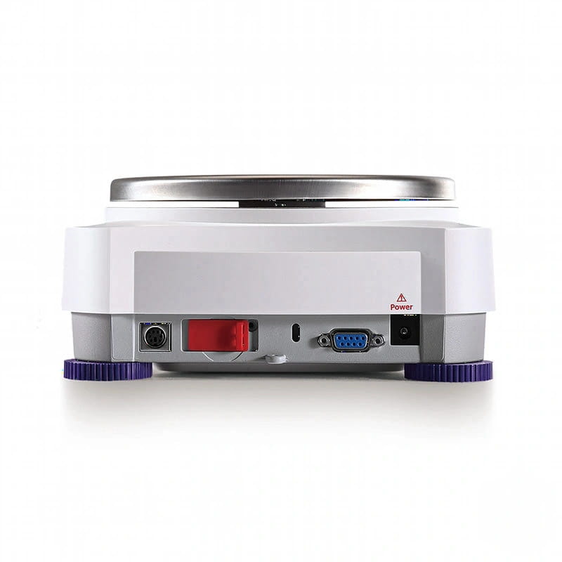 White and gray laboratory hot plate with a silver heating surface, purple adjustable feet, and multiple ports including a red power switch