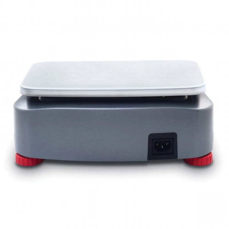 Gray digital scale with a white weighing platform and red feet