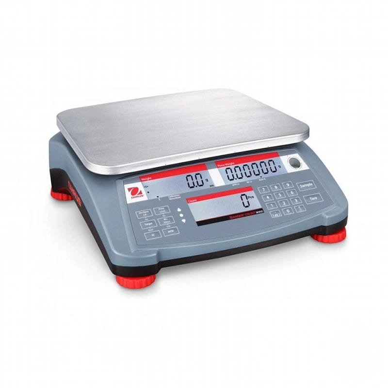Gray digital scale with a stainless steel weighing platform and red-accented feet