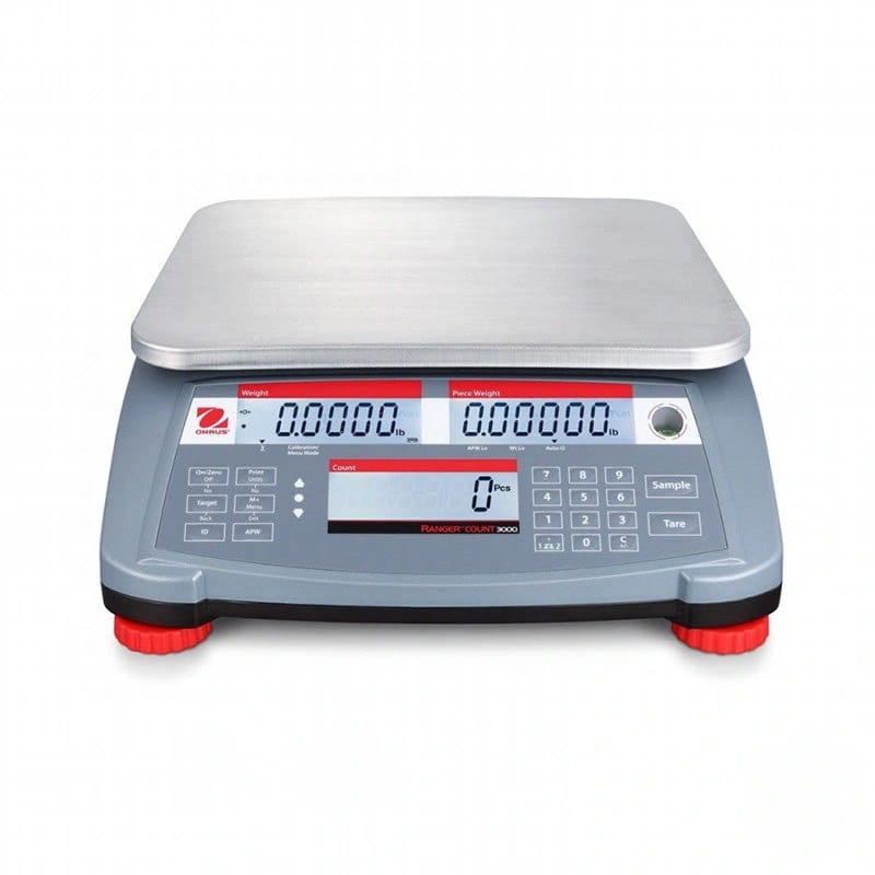 Gray digital scale with a stainless steel weighing platform and red rubber feet, featuring a display showing weight readings in pounds