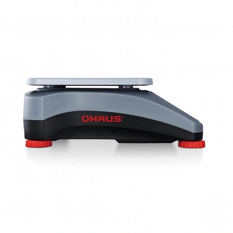 Gray and black ohaus digital scale with red feet
