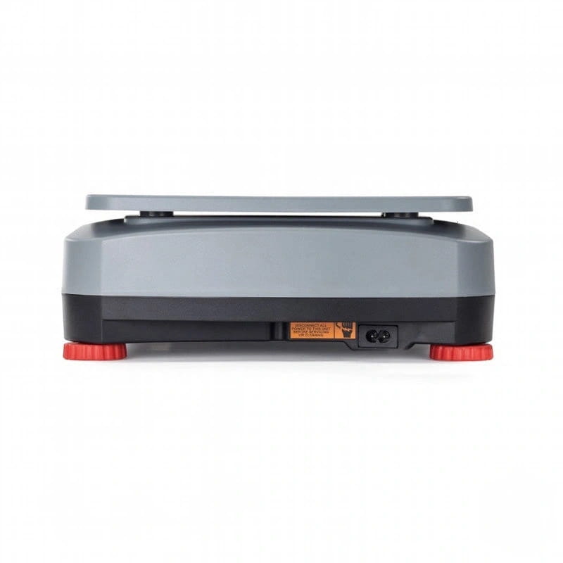 Gray and black digital scale with red rubber feet