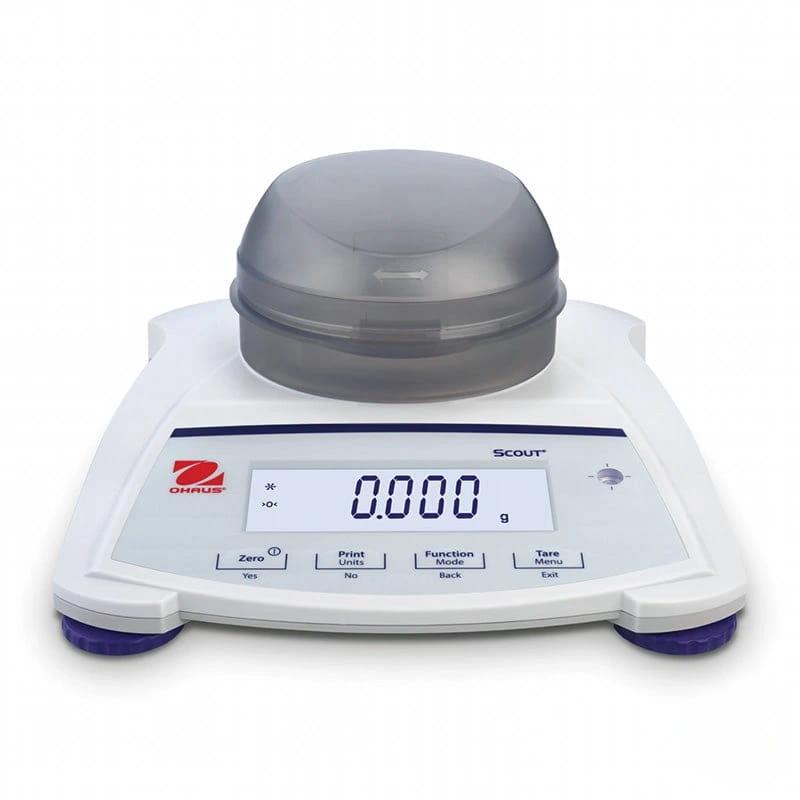 White digital laboratory scale with a gray dome-shaped weighing platform and purple feet, branded ’ohaus’ and model ’scout’
