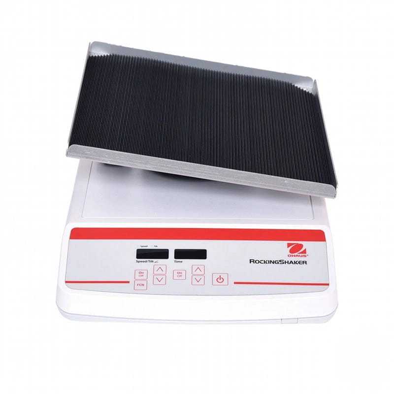 White and red ohaus rocking shaker with a black, ribbed shaking plate