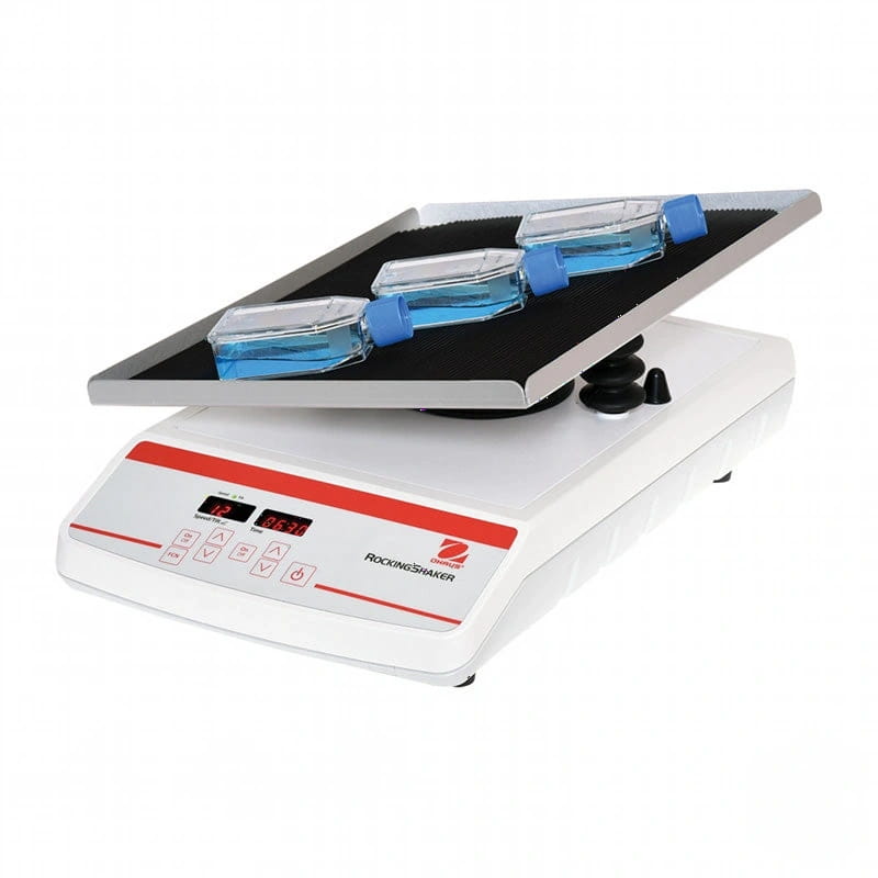 White and red digital rocking shaker with three transparent blue-lidded containers on its black platform