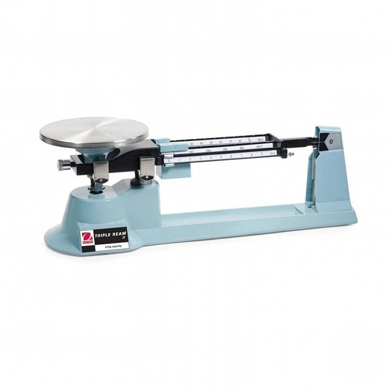 Light blue triple beam balance scale with a silver metal weighing pan and black measurement markings