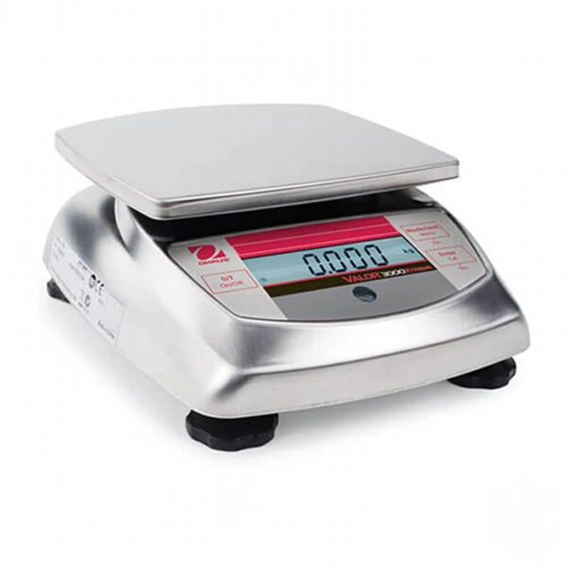 Silver digital platform scale with a red and blue display screen, black feet, and the brand name ’ohaus’ visible on its front panel