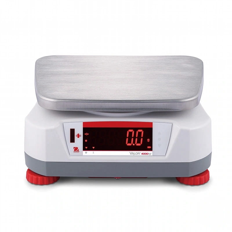 White and gray digital scale with a brushed stainless steel weighing platform, red led display showing ’0.0 g,’ and red rubber feet; model valor 4000 w by ohaus