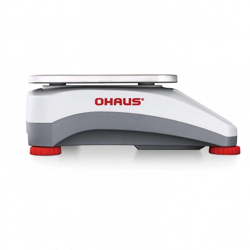 White and gray ohaus digital scale with red feet