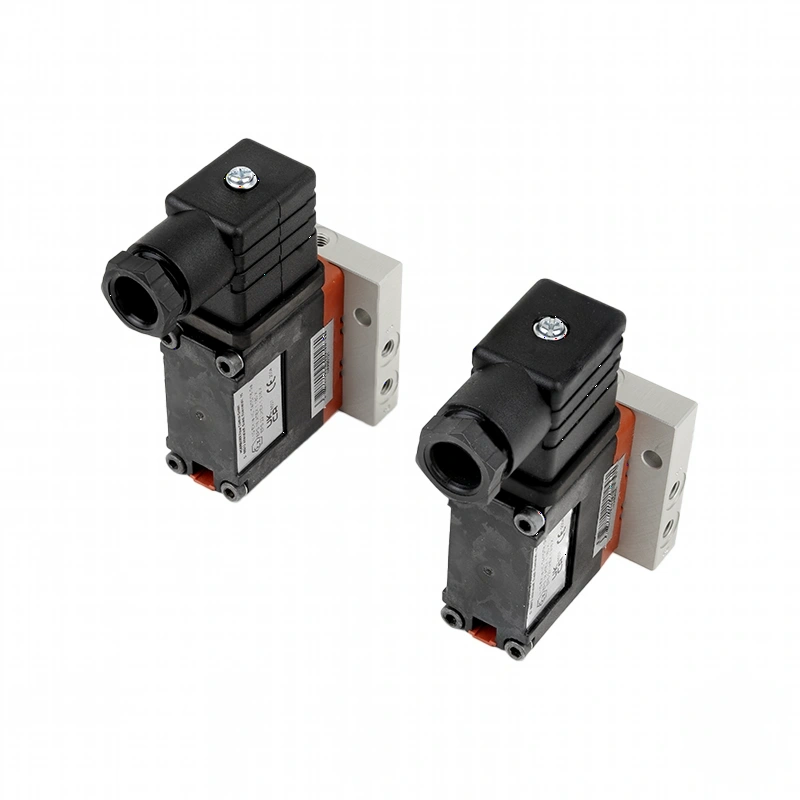 Black and gray industrial solenoid valves with orange accents