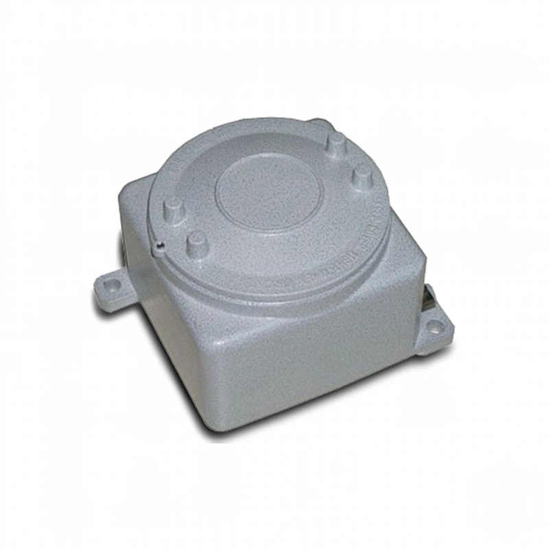 Gray metallic electrical junction box with a circular lid and mounting flanges