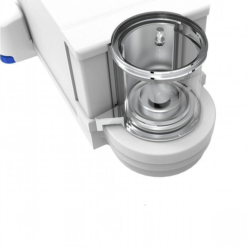 White medical device with a transparent cylindrical chamber and metallic components
