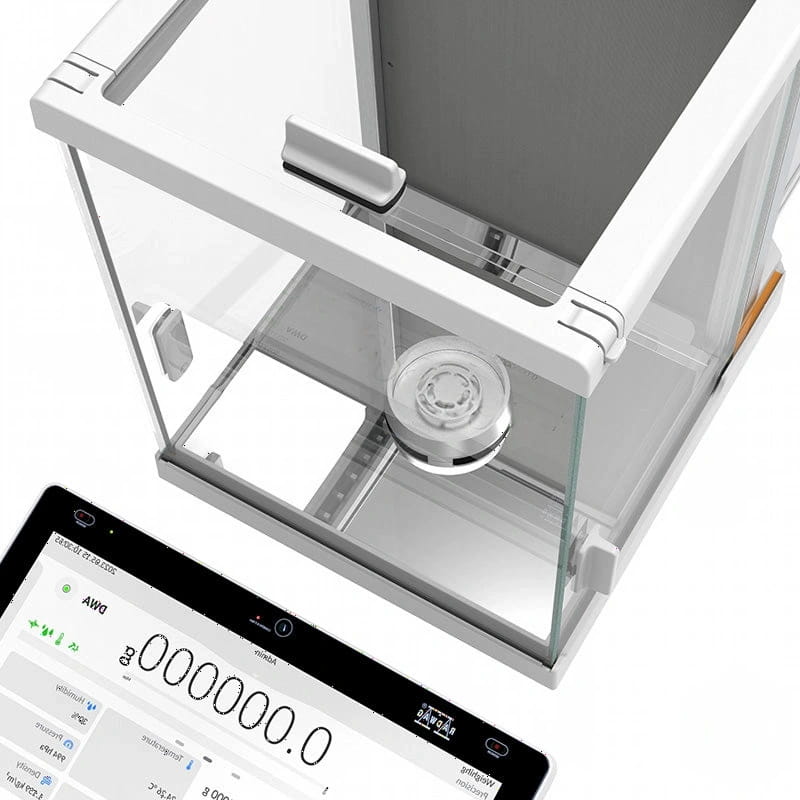 White digital analytical balance with transparent glass enclosure and a circular weighing platform