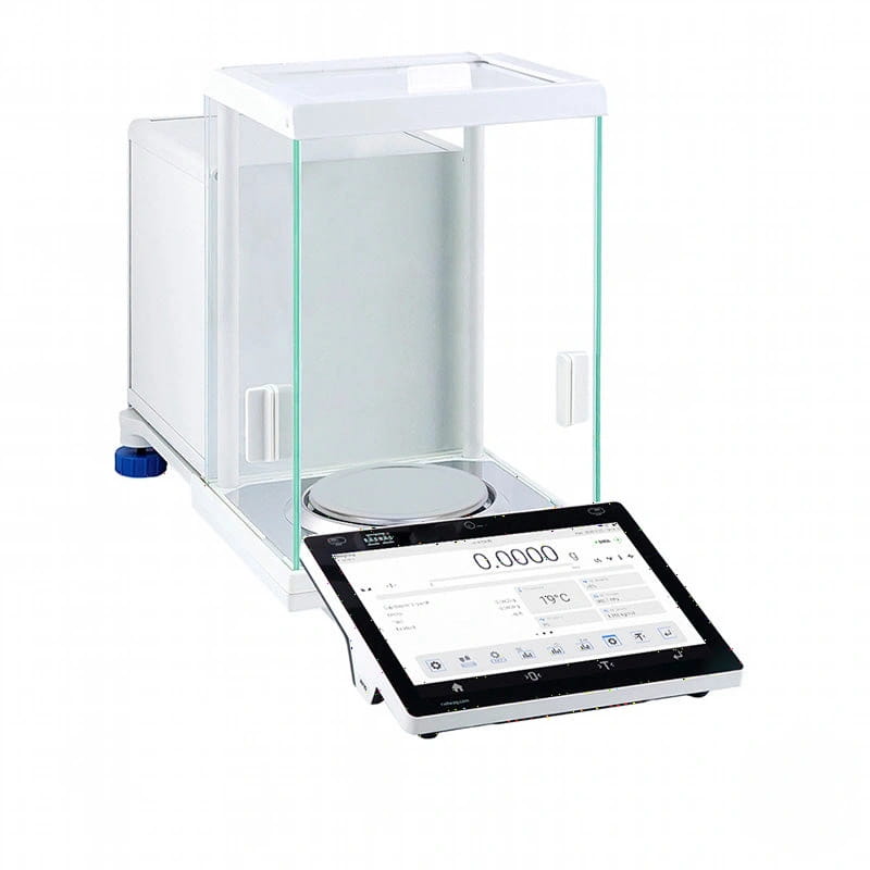 White analytical balance with transparent glass draft shield and digital touchscreen display