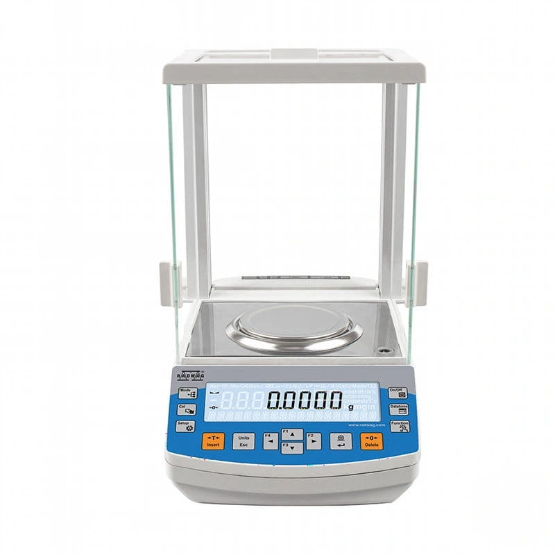 White and blue digital analytical balance with a glass draft shield