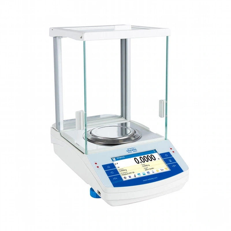 White analytical balance with a glass draft shield and blue digital display