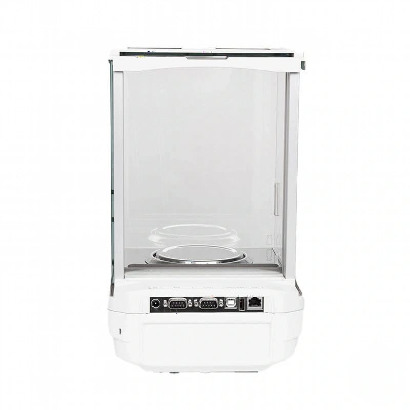 White analytical balance with transparent glass enclosure and metallic weighing platform