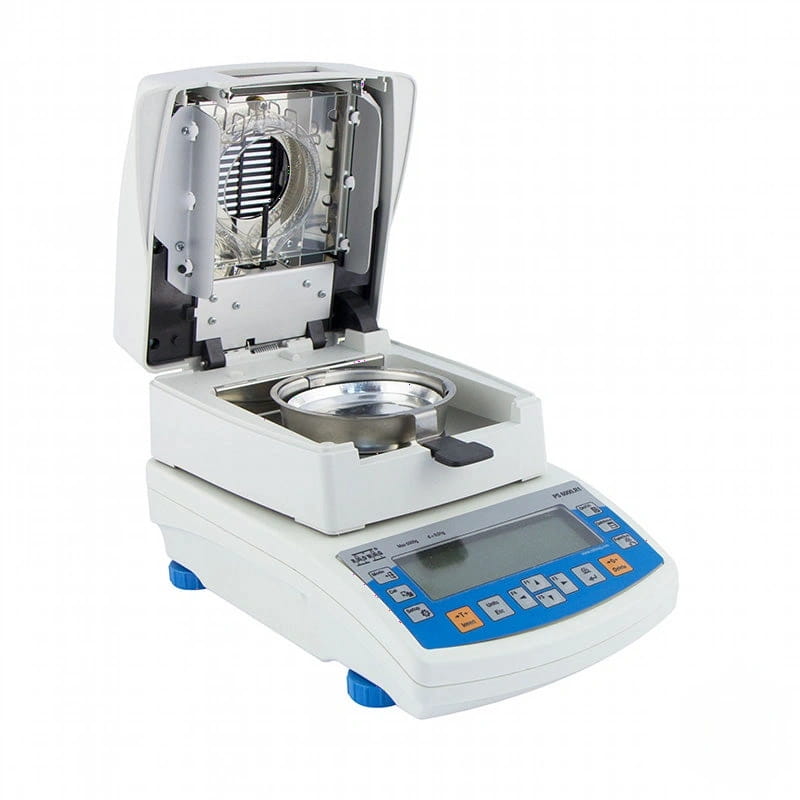 White and blue laboratory moisture analyzer with a digital display, control panel, and open lid revealing an internal chamber containing a metal bowl