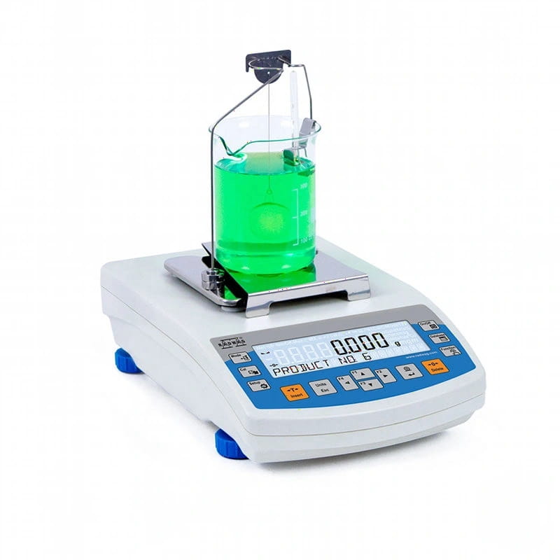 White digital laboratory scale with blue accents and a glass beaker filled with green liquid on its platform