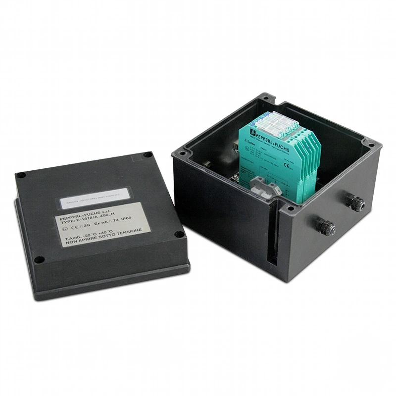 Teal-colored industrial electrical module housed inside a black plastic enclosure with mounting hardware
