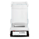White ohaus explorer™ analytical balance with a transparent glass draft shield and digital display showing zeroed weight