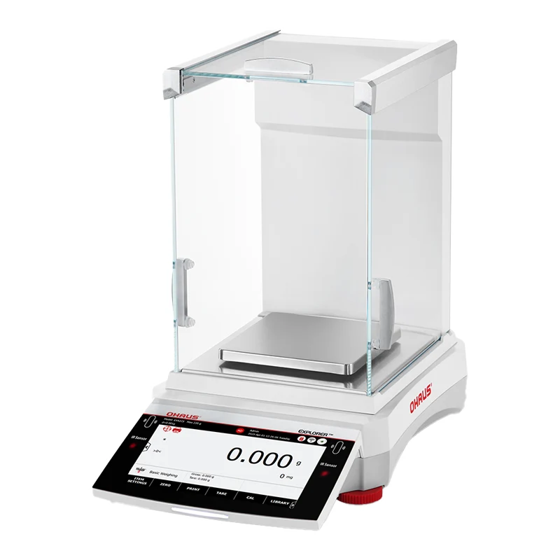 White ohaus analytical balance with transparent glass draft shield and digital display showing zeroed weight reading